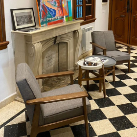 chairs in front of a fireplace