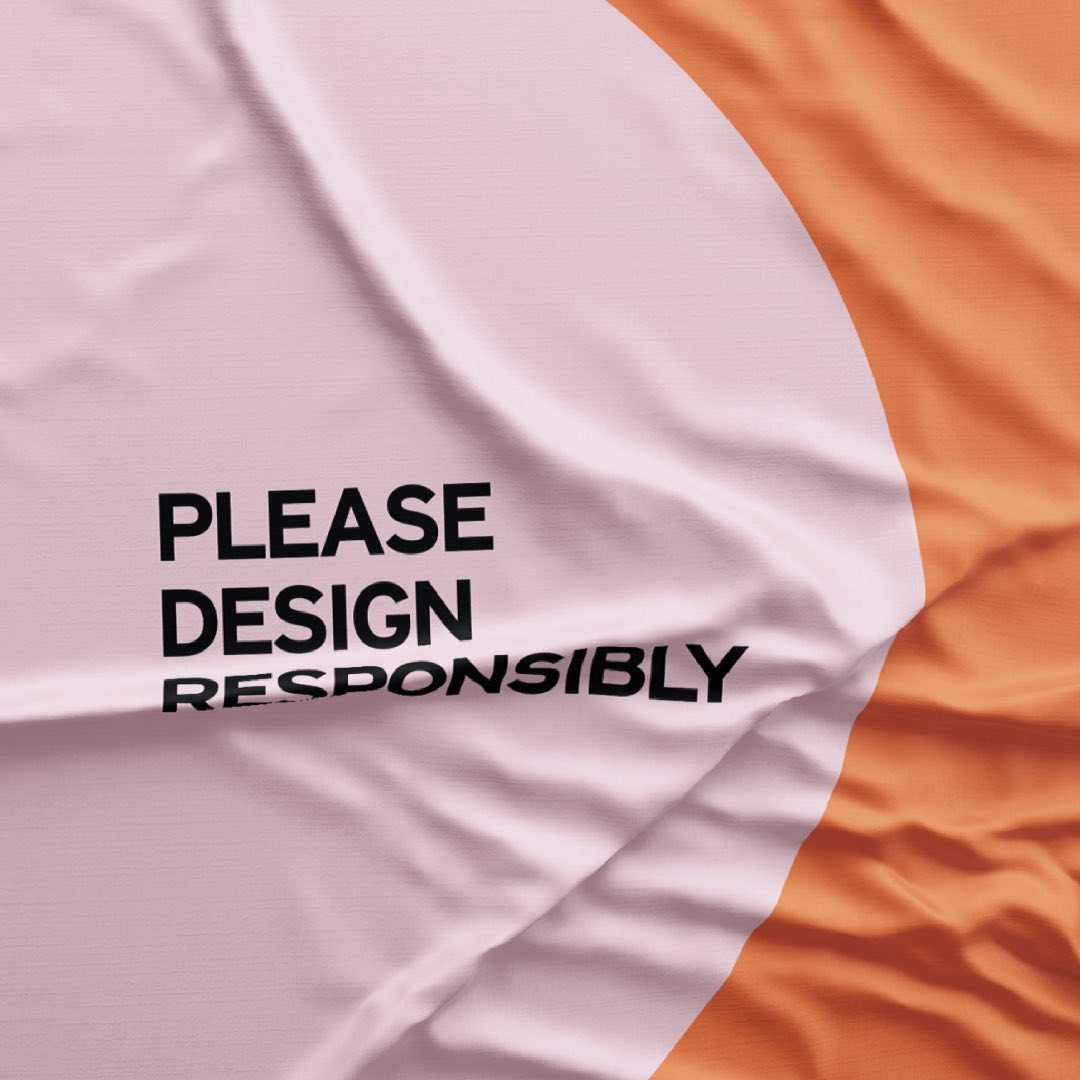 a pink and orange cloth reading please design responsibly